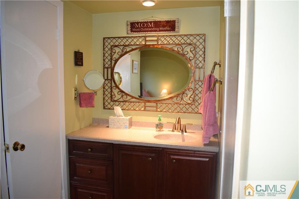 10 Harper Road Monmouth Junction, NJ 08852 - Photo 15 of 24 a bathroom with a sink and a mirror