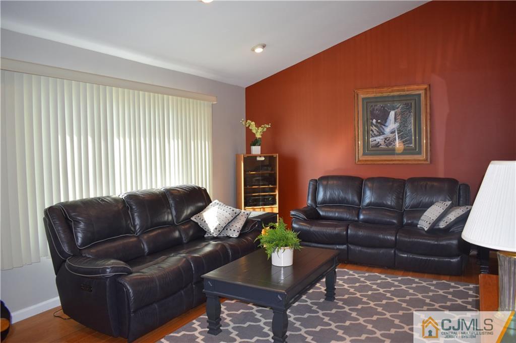 10 Harper Road Monmouth Junction, NJ 08852 - Photo 3 of 24 a living room with furniture and a potted plant