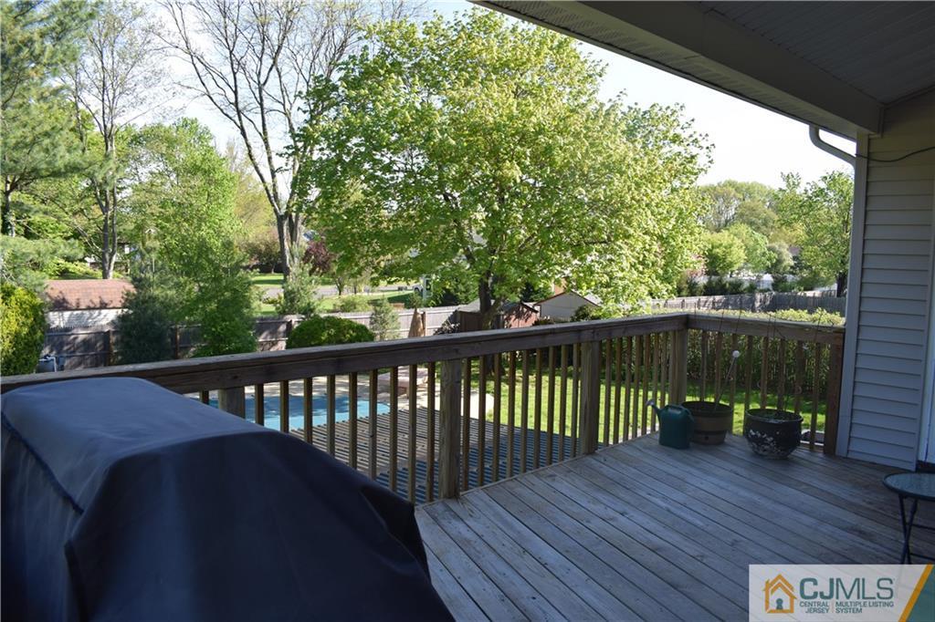 10 Harper Road Monmouth Junction, NJ 08852 - Photo 22 of 24 a balcony with wooden floor and outdoor space