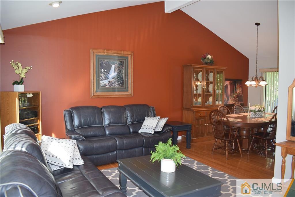 10 Harper Road Monmouth Junction, NJ 08852 - Photo 4 of 24 a living room with furniture and wooden floor