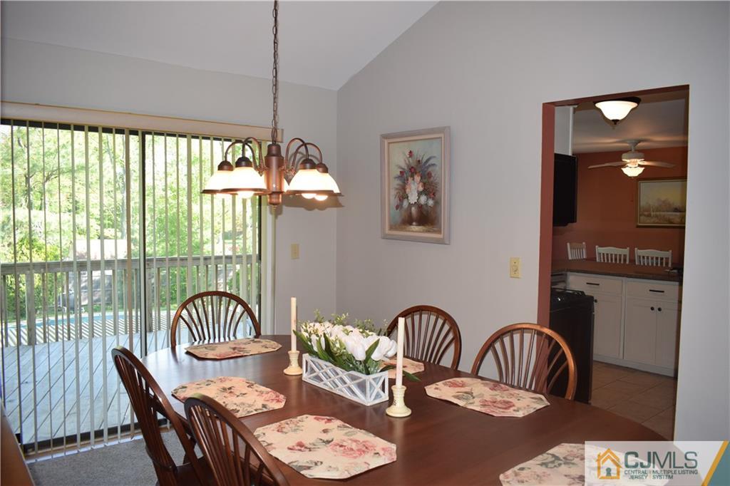 10 Harper Road Monmouth Junction, NJ 08852 - Photo 5 of 24 a dining room with furniture a chandelier and window