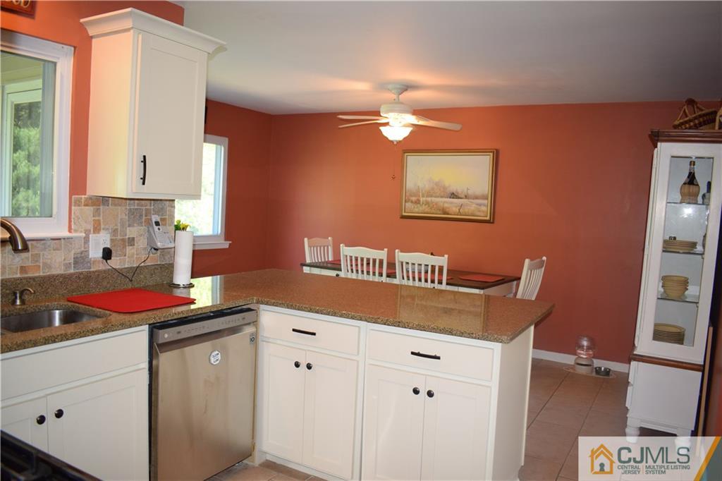 10 Harper Road Monmouth Junction, NJ 08852 - Photo 8 of 24 a kitchen with a sink and cabinets