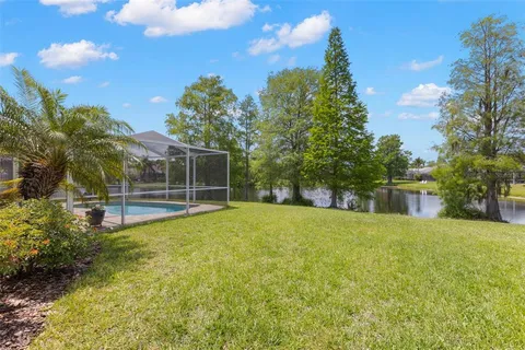 a view of a house with swimming pool and sitting area