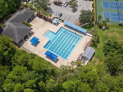 an aerial view of a residential apartment building with a yard