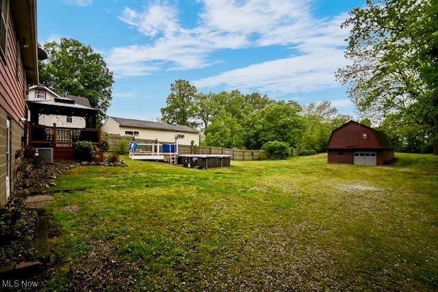 3364 Cormany Road Akron, OH 44319 - Photo 5 of 44 View of grassy yard featuring a wooden deck and an outbuilding