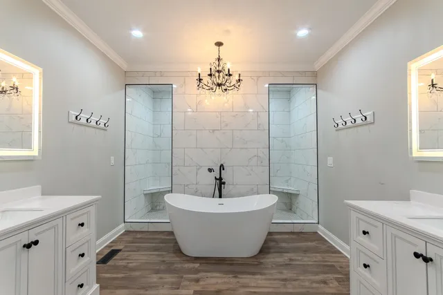 a bathroom with a white tub sink and mirror