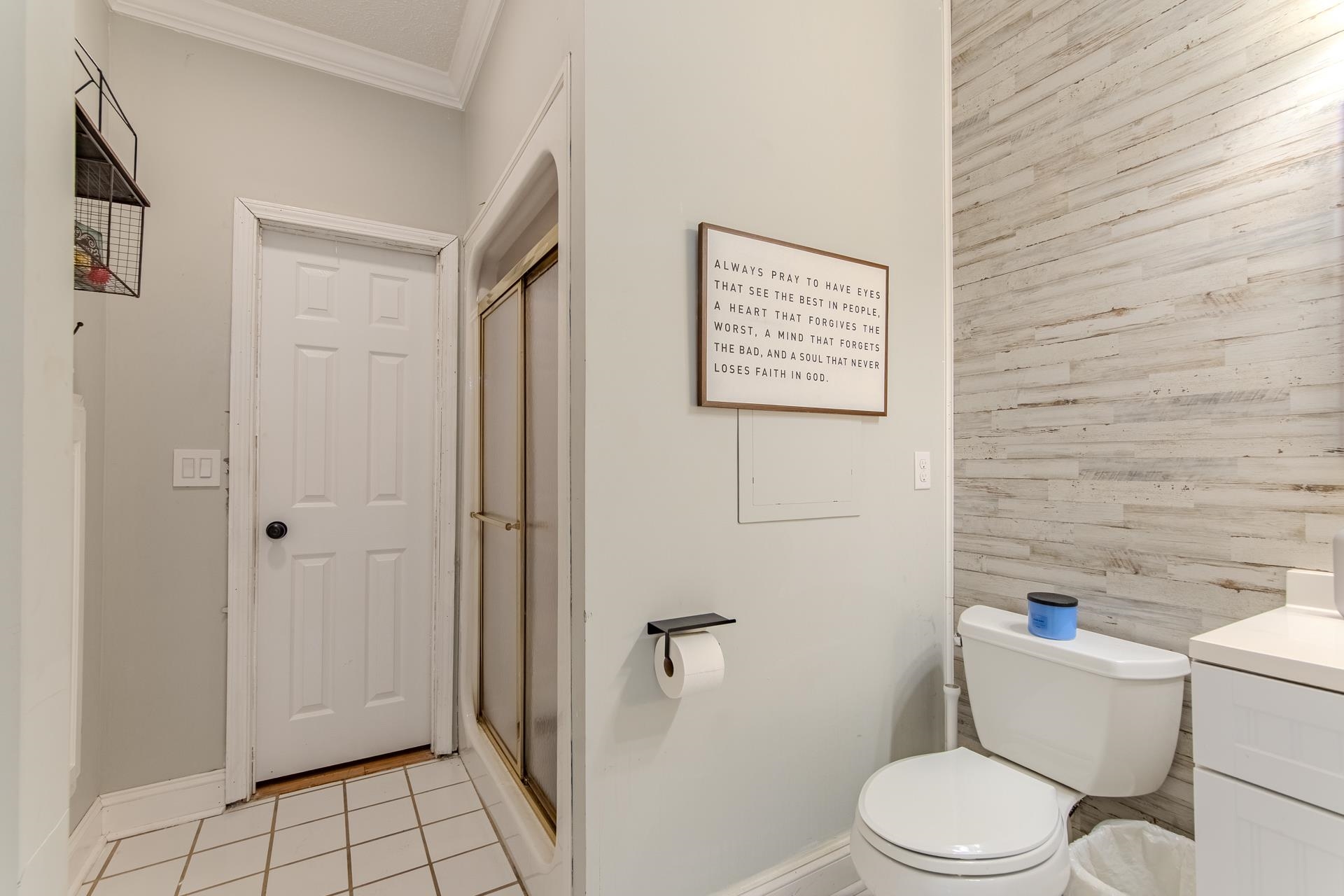 635 Patterson Road Savannah, TN 38372 - Photo 14 of 33 a white toilet sitting next to a bathroom sink