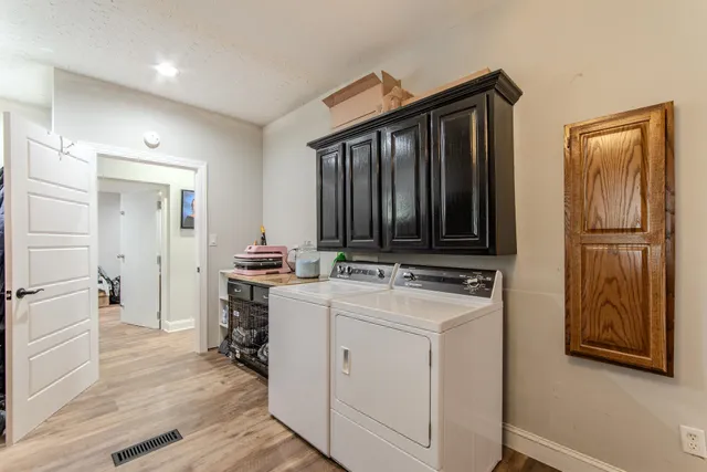 a view of a workspace with furniture and wooden floor