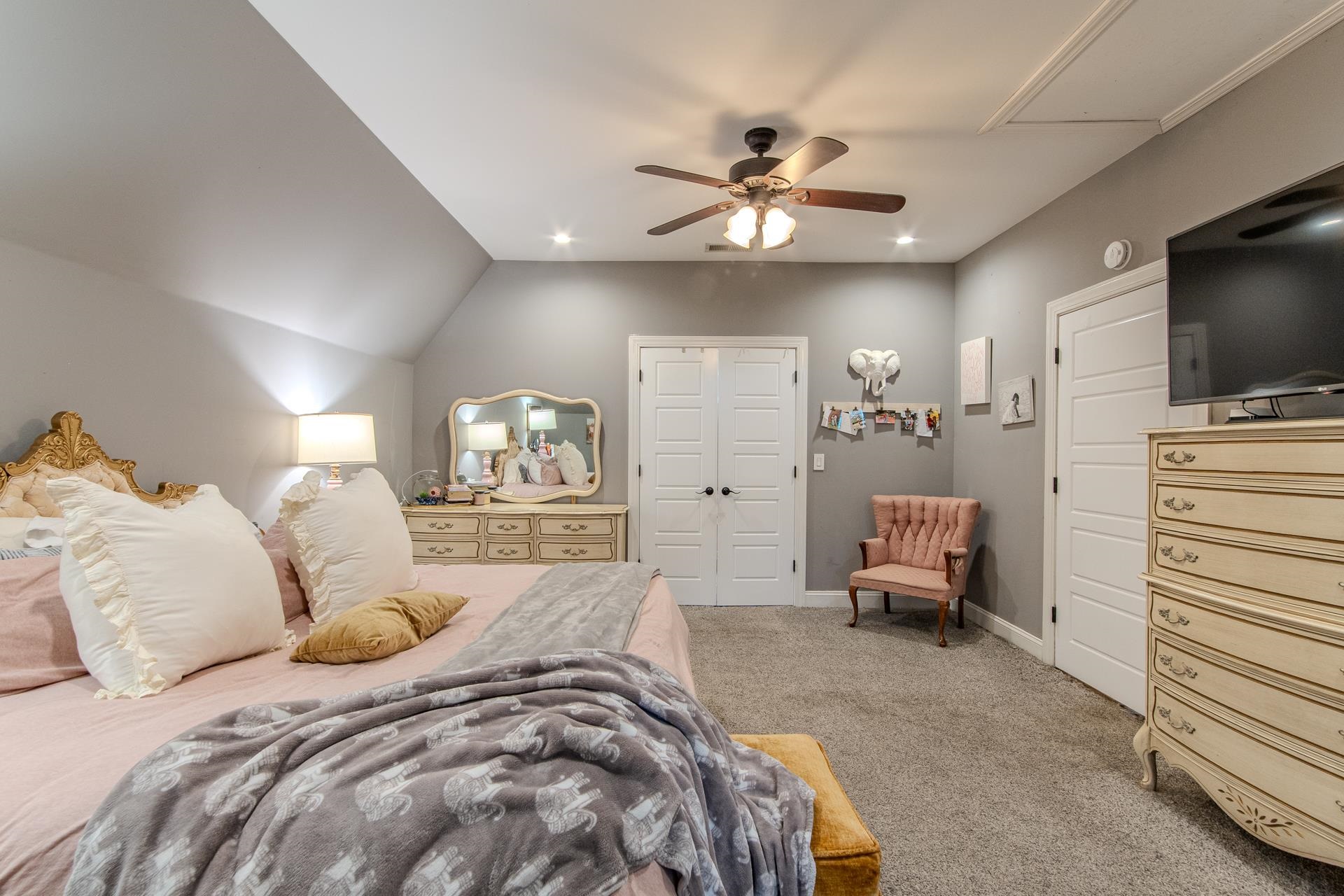 635 Patterson Road Savannah, TN 38372 - Photo 18 of 33 a spacious bedroom with a bed and a flat screen tv