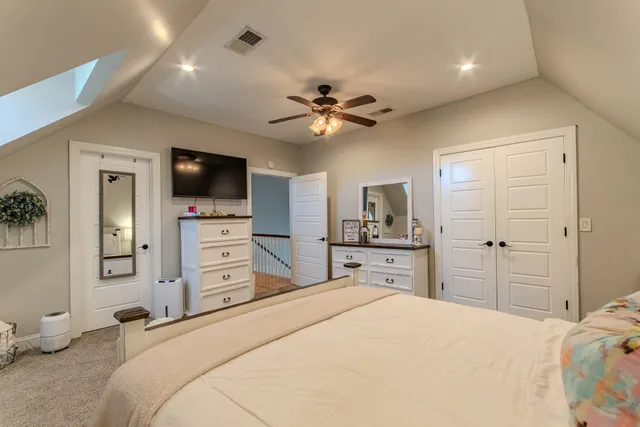 a bed room with a bed and a television