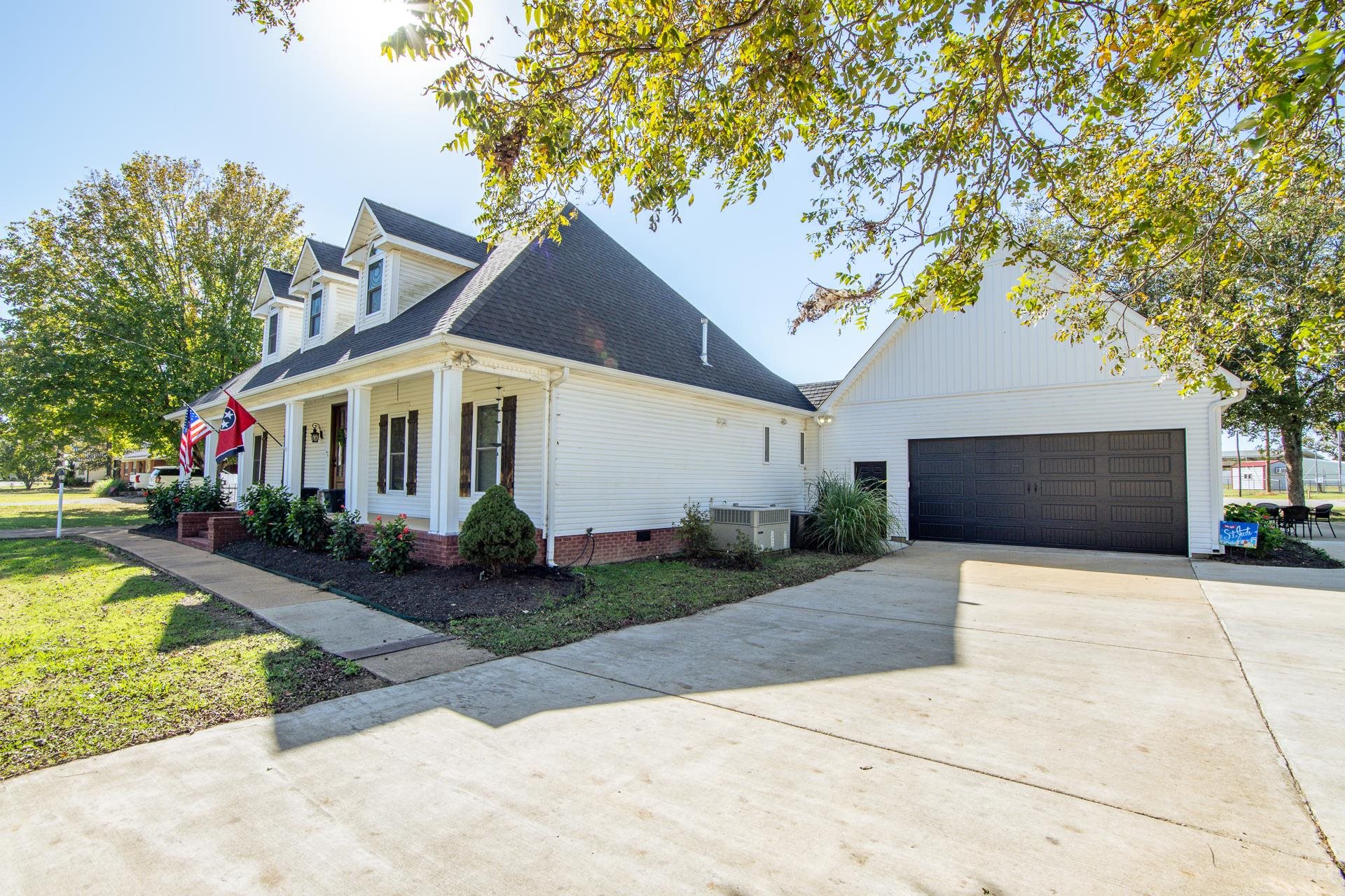 635 Patterson Road Savannah, TN 38372 - Photo 23 of 33 a front view of a house with a yard and garage