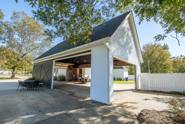 a backyard of a house with a garage