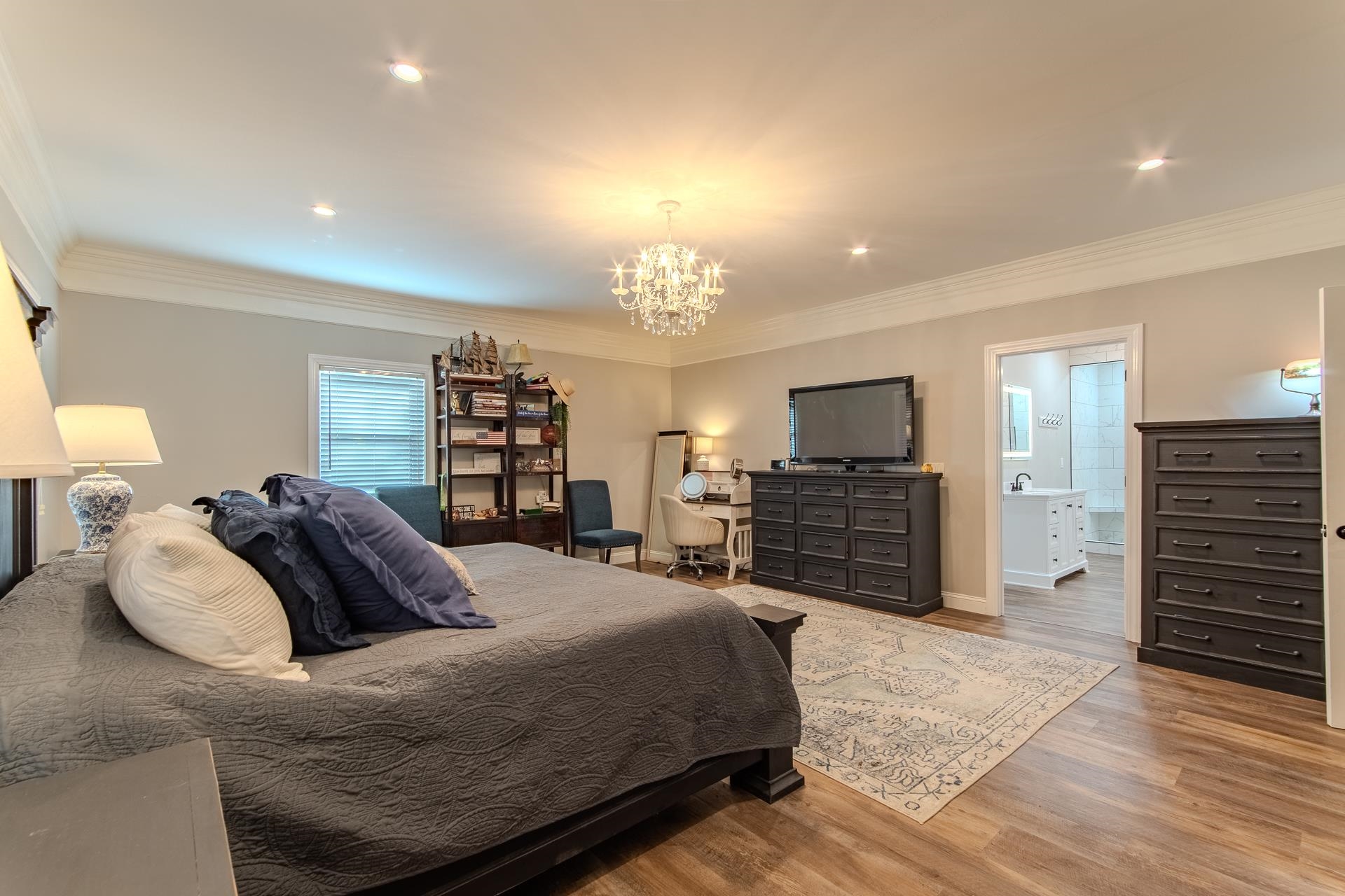 635 Patterson Road Savannah, TN 38372 - Photo 9 of 33 a spacious bedroom with a bed and a television in it