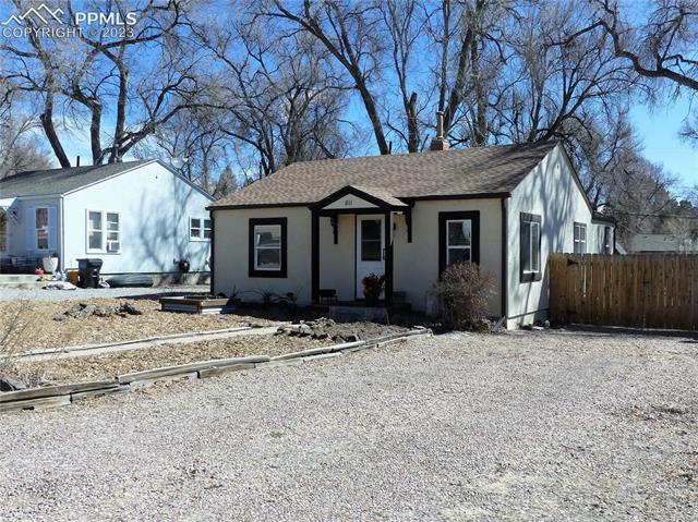 811 Prairie Road Colorado Springs, CO 80909 - Photo 2 of 28 Graveled driveway with plenty of parking space in front