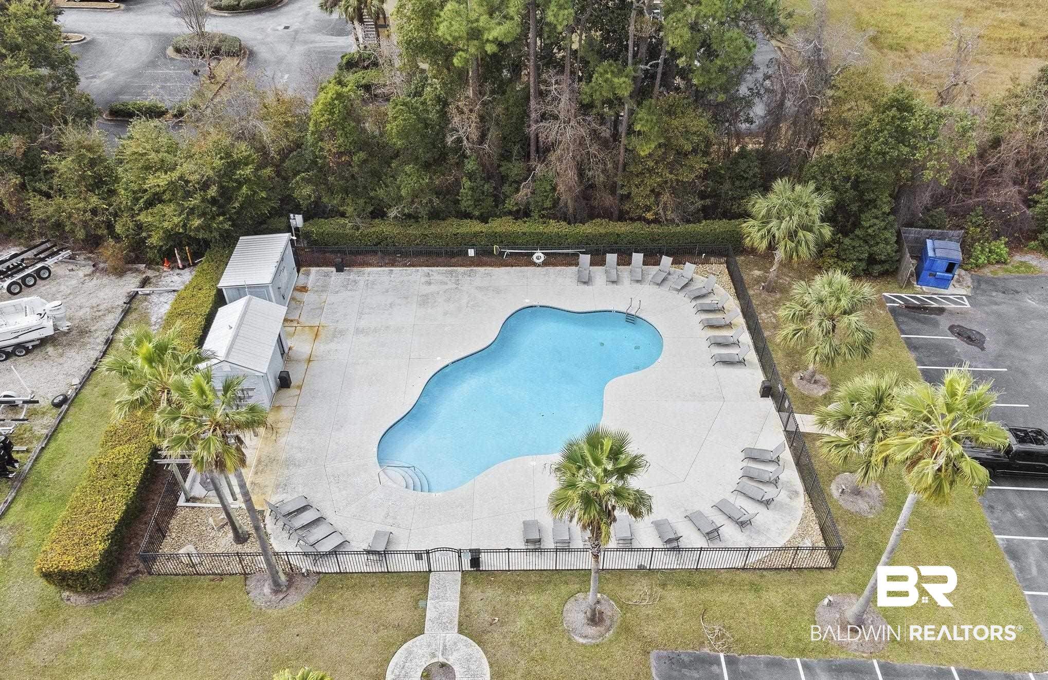 25861 Canal Road, Unit 77 Orange Beach, AL 36561 - Photo 42 of 48 Community pool with a patio area