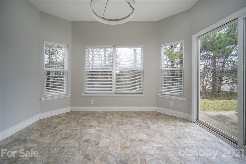 382 Primrose Walk Fort Mill, SC 29715 - Photo 12 of 20 a view of an empty room with glass door