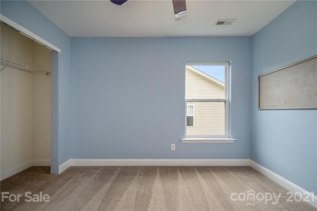 382 Primrose Walk Fort Mill, SC 29715 - Photo 18 of 20 an empty room with a window