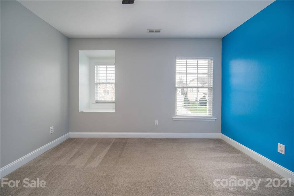 382 Primrose Walk Fort Mill, SC 29715 - Photo 19 of 20 an empty room with a window