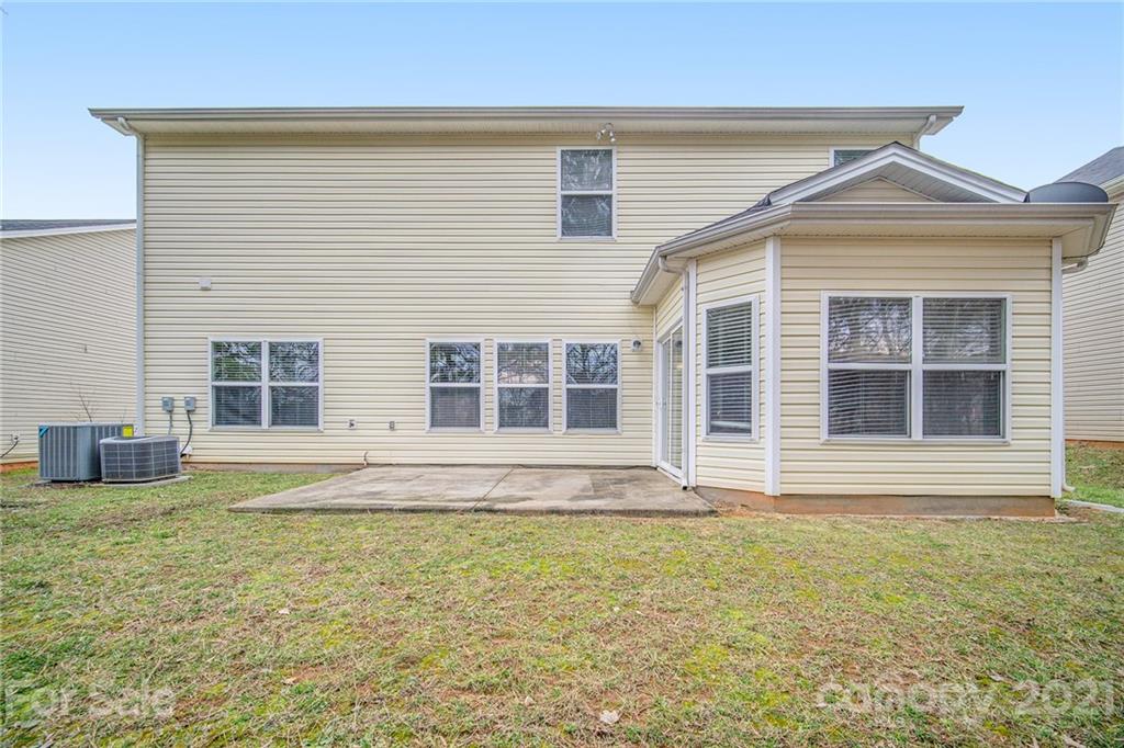 382 Primrose Walk Fort Mill, SC 29715 - Photo 5 of 20 a front view of a house with a yard