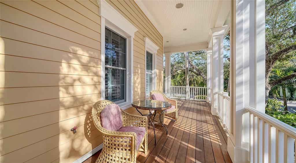 5309 Hidden Harbor Road Sarasota, FL 34242 - Photo 13 of 100 a view of balcony with two chairs and a table