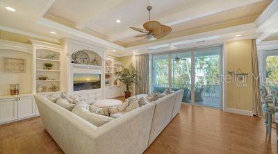 5309 Hidden Harbor Road Sarasota, FL 34242 - Photo 17 of 88 a living room with furniture and a large window
