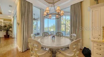 a bathroom with a granite countertop sink a mirror and a shower