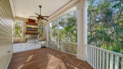 5309 Hidden Harbor Road Sarasota, FL 34242 - Photo 30 of 88 a view of a kitchen with a sink and wooden floor