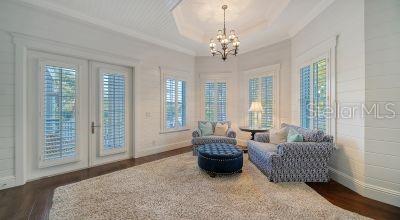 5309 Hidden Harbor Road Sarasota, FL 34242 - Photo 39 of 88 a spacious bedroom with furniture and a large window