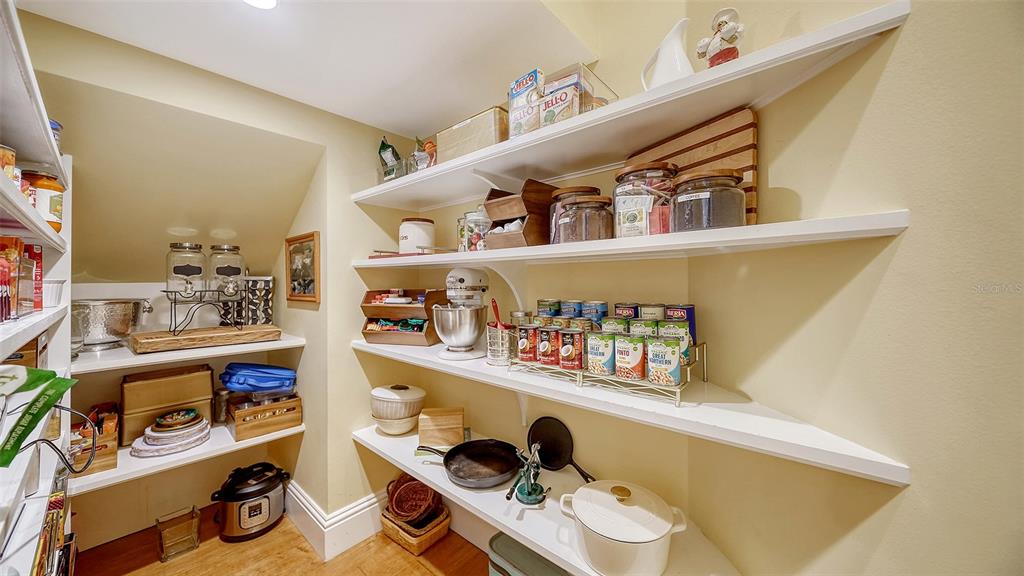 5309 Hidden Harbor Road Sarasota, FL 34242 - Photo 42 of 100 a shelf with books and knick knacks on it