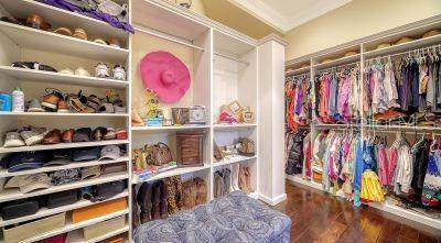 5309 Hidden Harbor Road Sarasota, FL 34242 - Photo 43 of 88 a view of walk in closet with clothes and shoes