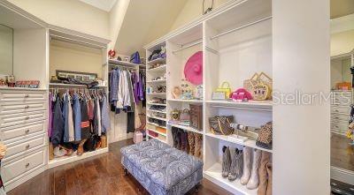 5309 Hidden Harbor Road Sarasota, FL 34242 - Photo 44 of 88 a view of walk in closet with clothes and shoes