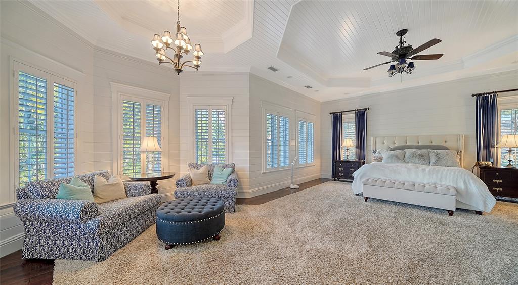 5309 Hidden Harbor Road Sarasota, FL 34242 - Photo 55 of 100 a spacious bedroom with a bed and window