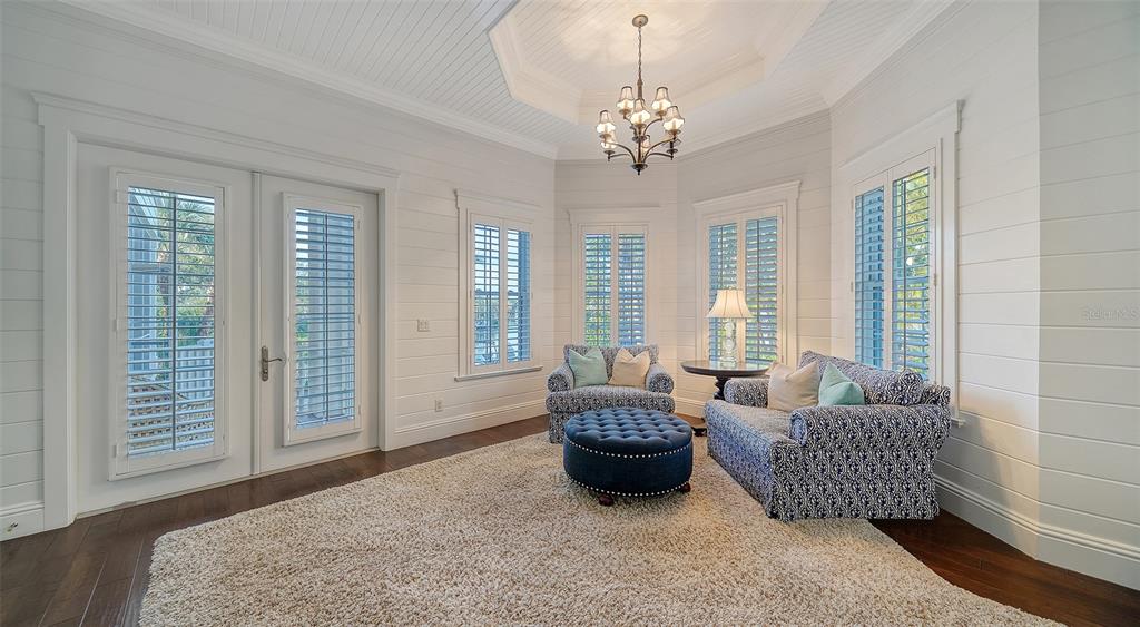 5309 Hidden Harbor Road Sarasota, FL 34242 - Photo 56 of 100 a spacious bedroom with furniture and a large bed