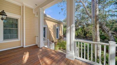 5309 Hidden Harbor Road Sarasota, FL 34242 - Photo 6 of 88 a view of a balcony with wooden floor and outdoor space