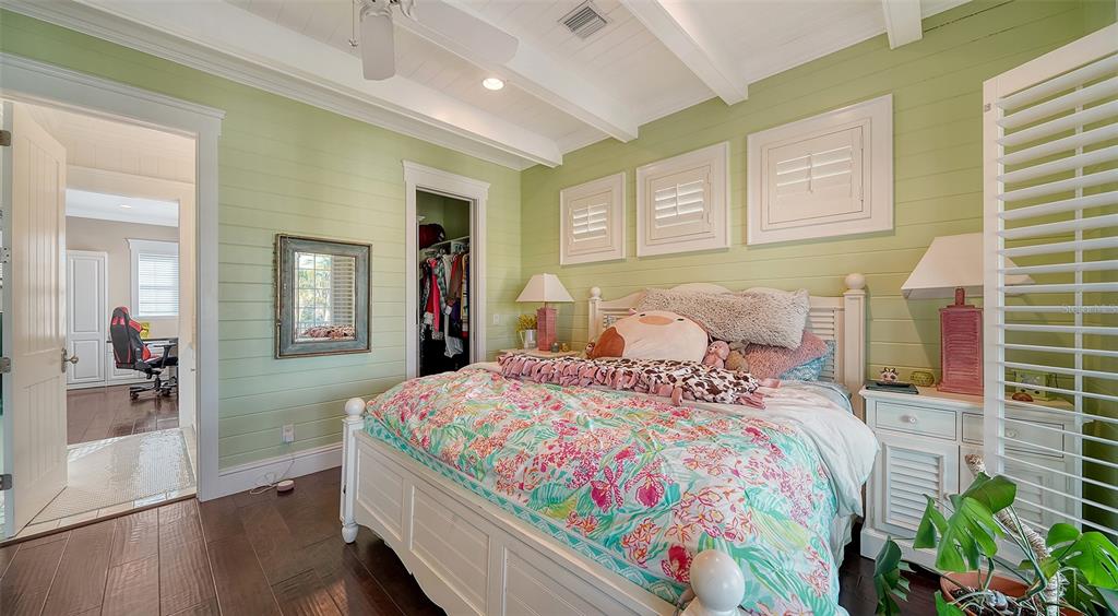 5309 Hidden Harbor Road Sarasota, FL 34242 - Photo 66 of 100 a bedroom with a bed and wooden floor