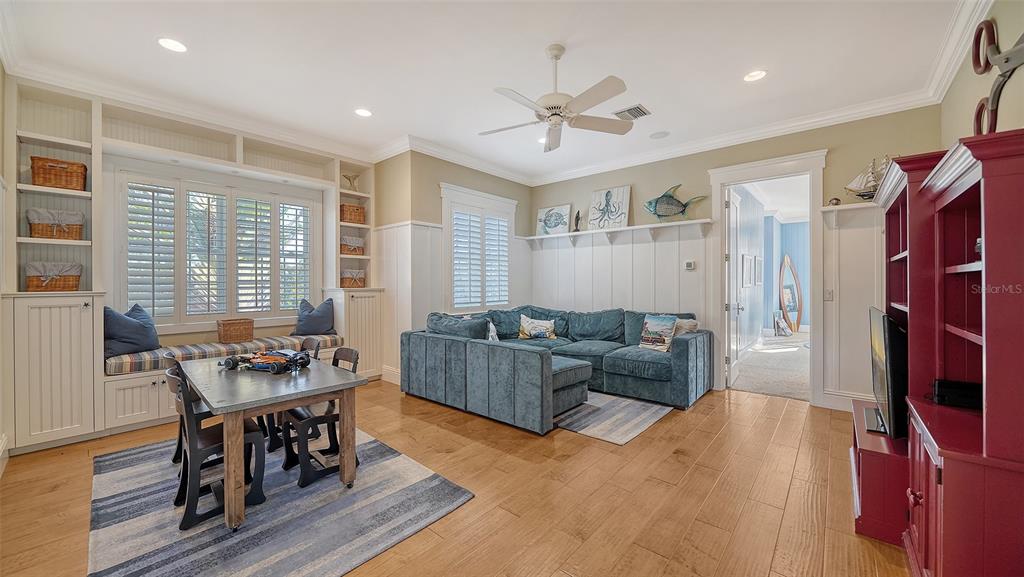 5309 Hidden Harbor Road Sarasota, FL 34242 - Photo 71 of 100 a living room with furniture and a flat screen tv