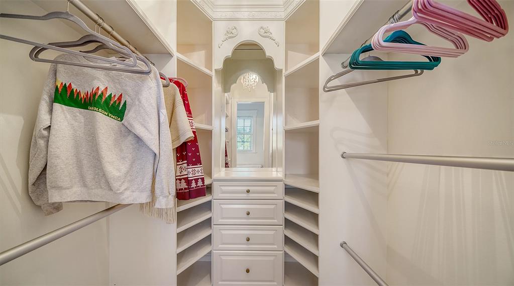 5309 Hidden Harbor Road Sarasota, FL 34242 - Photo 75 of 100 a view of walk in closet with clothes and white walls