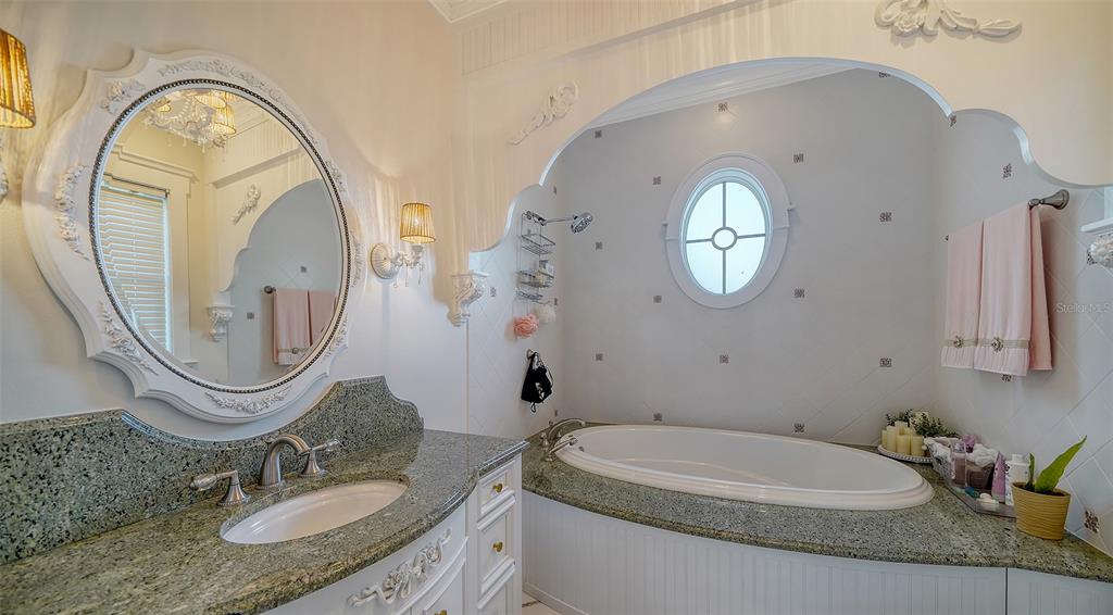 5309 Hidden Harbor Road Sarasota, FL 34242 - Photo 76 of 100 a bathroom with a granite countertop sink mirror and toilet
