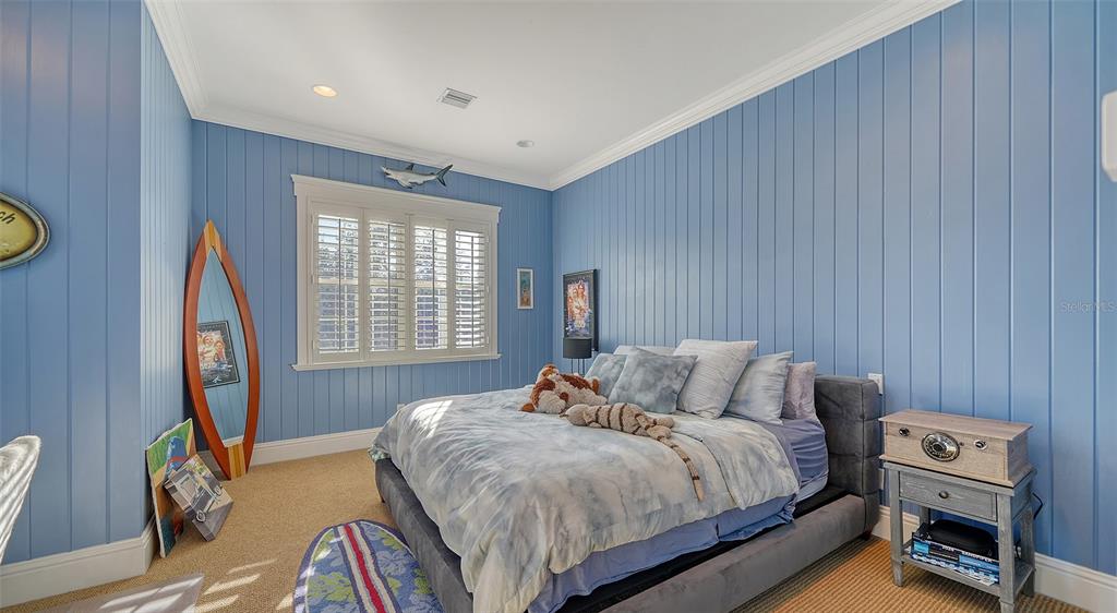 5309 Hidden Harbor Road Sarasota, FL 34242 - Photo 77 of 100 a bedroom with a bed and a window