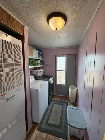 a kitchen with stainless steel appliances granite countertop a stove top oven a sink and a window