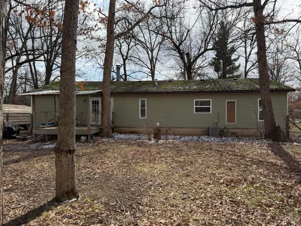 a house with trees in the background