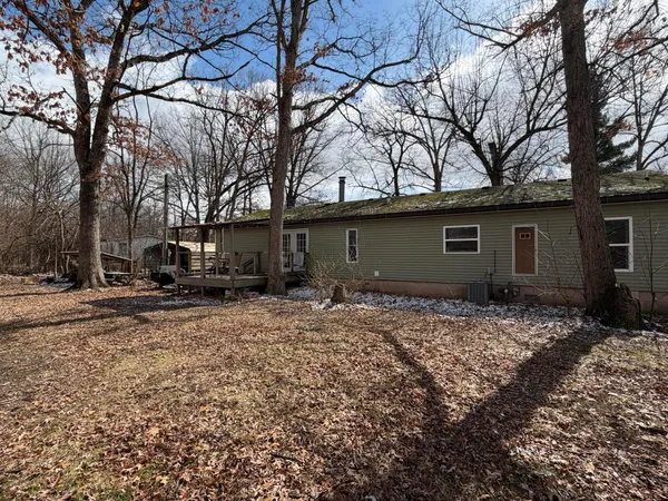 a house view with a car parked in front of it