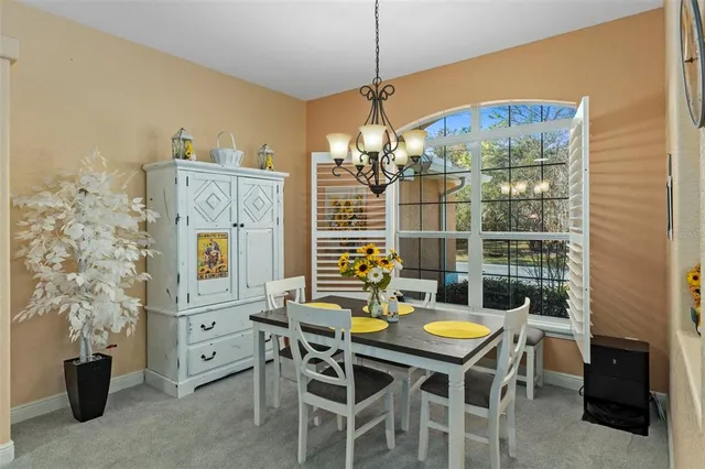 a kitchen with stainless steel appliances kitchen island granite countertop a sink and cabinets