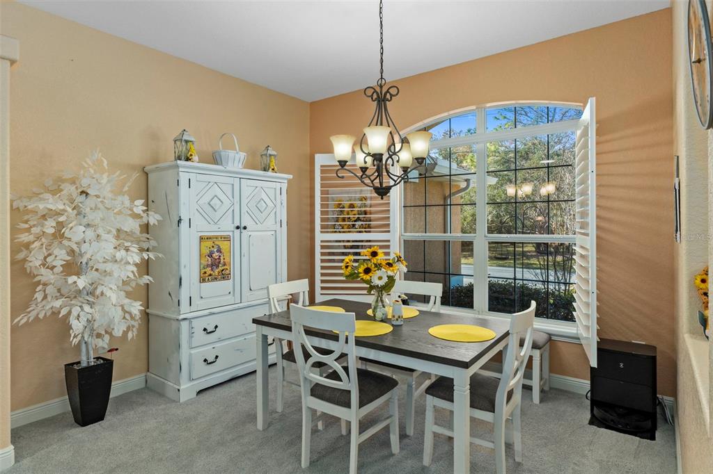 39 Linder Street Homosassa, FL 34446 - Photo 12 of 63 a view of a dining room with furniture and chandelier