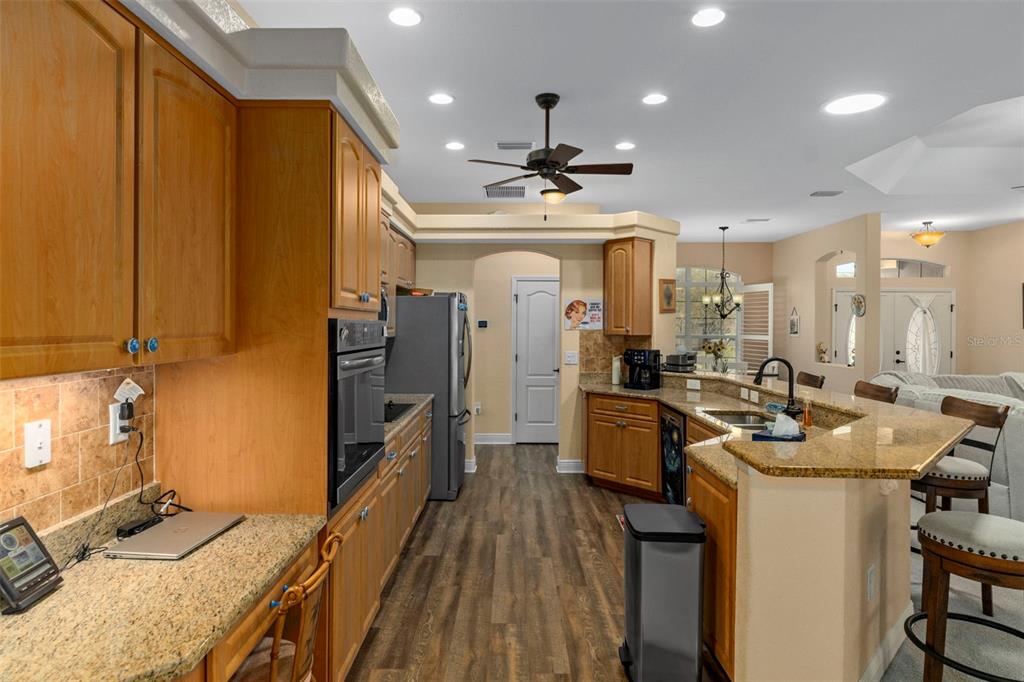 39 Linder Street Homosassa, FL 34446 - Photo 16 of 63 a kitchen with furniture a counter top space a sink a window and stainless steel appliances