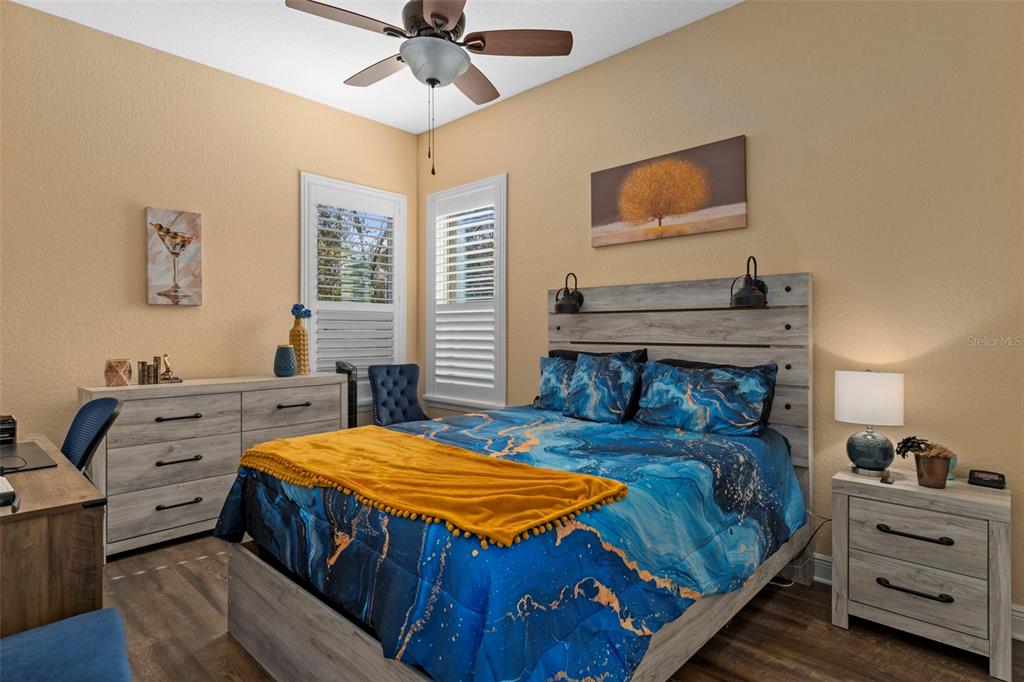 39 Linder Street Homosassa, FL 34446 - Photo 21 of 63 a bedroom with a bed and a chandelier