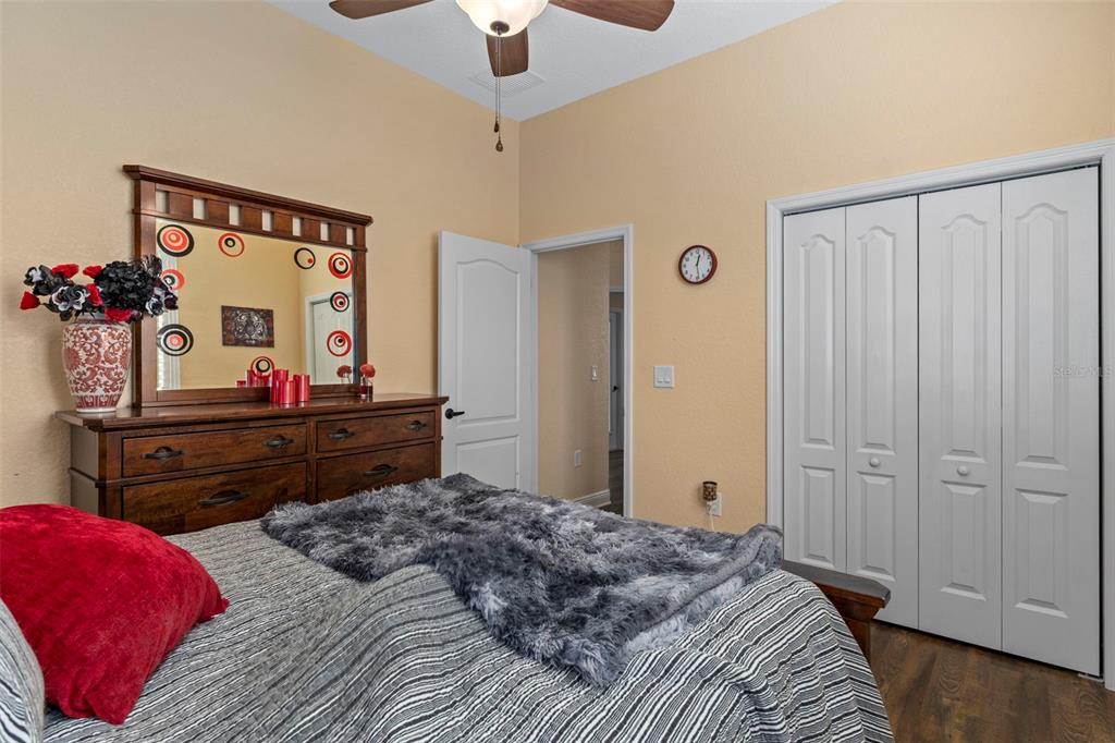 39 Linder Street Homosassa, FL 34446 - Photo 24 of 63 a bedroom with a bed and a dresser