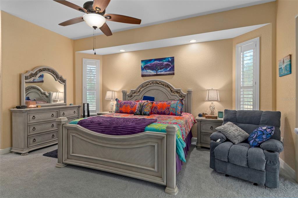 39 Linder Street Homosassa, FL 34446 - Photo 25 of 63 a bedroom with a bed and ceiling fan