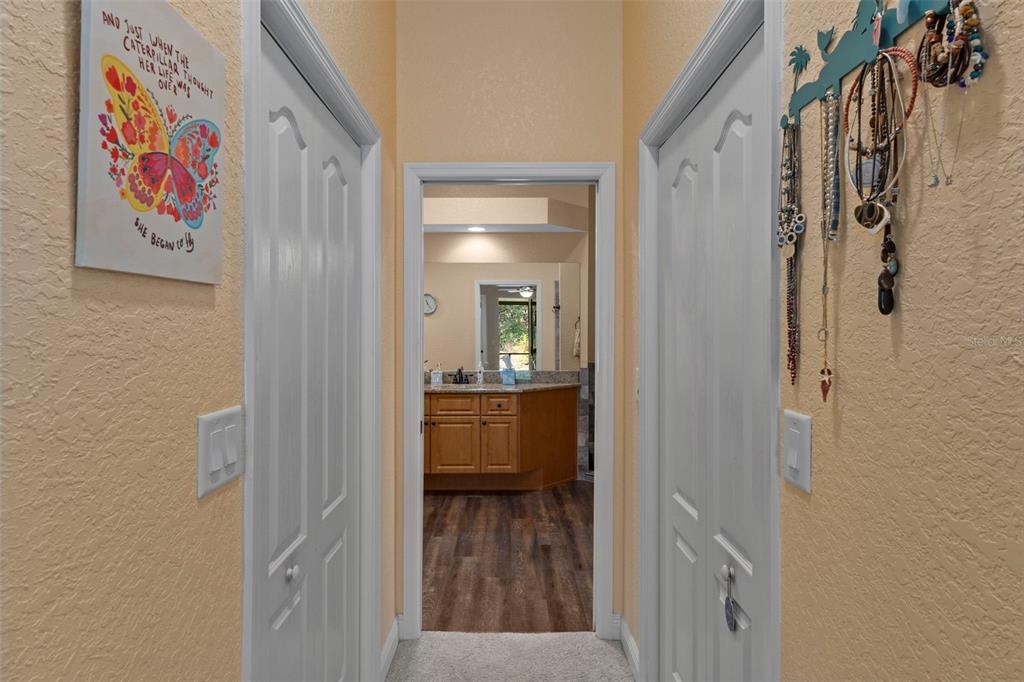 39 Linder Street Homosassa, FL 34446 - Photo 28 of 63 a view of a hallway with wooden floor and dining room