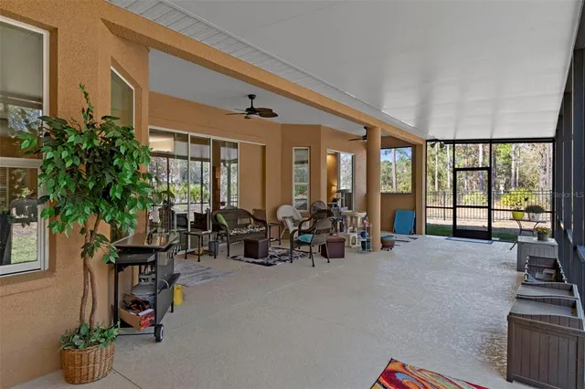 a view of a patio with swimming pool and table